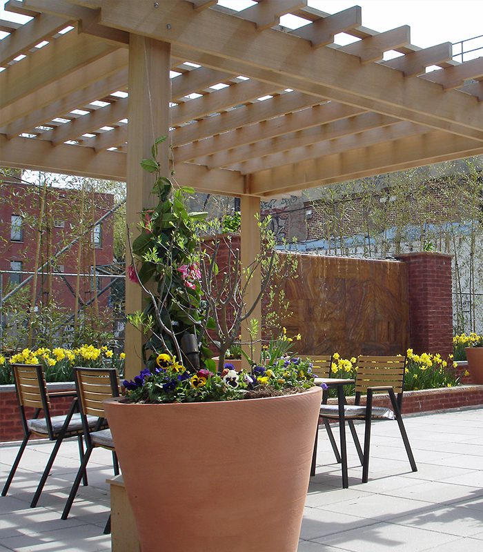 A large planter with flowers in it