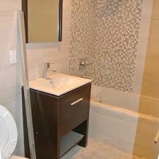 A bathroom with a sink, mirror and bathtub.